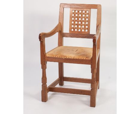 ROBERT ‘MOUSEMAN’ THOMPSON OAK CARVER ARMCHAIR, the square back with carved lattice work panel, set above downswept arms and 