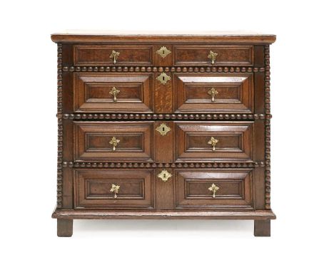 An Oak Jacobean Straight Front Chest of Drawers, late 17th century, the moulded top above four geometric two-as-one moulded d