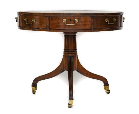 A George III Sheraton Period Mahogany Drum Table, circa 1780, of attractive proportions, with brown and gilt leather surface 