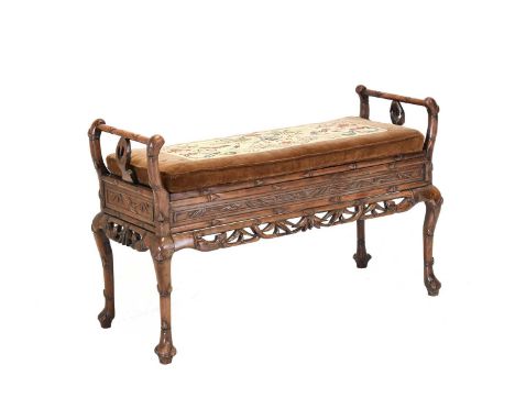 A Chinese Hardwood Bench or Window Seat, circa 1900, the boarded hinged seat between carved and scrolled arm supports above a