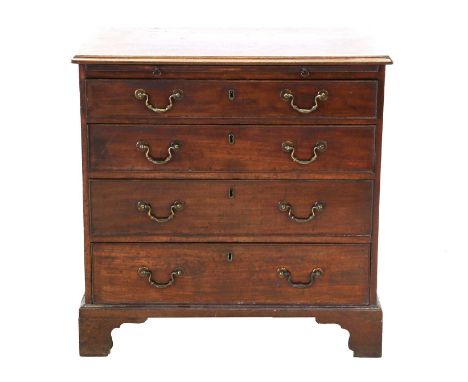 A George III Mahogany, Crossbanded and Oak-Lined Straight Front Chest of Drawers, circa 1800, the moulded top above a pull-ou