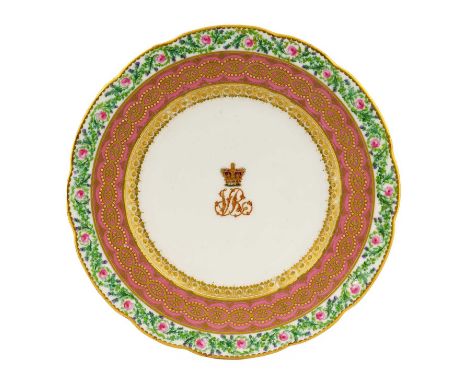 A Kerr & Binns Worcester Porcelain Plate, circa 1862, painted and gilt with a crowned VR monogram within a pink band gilt wit