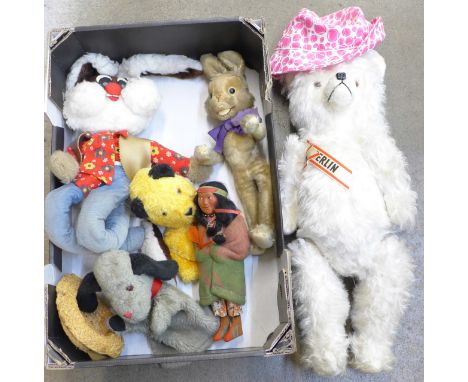 A collection of Teddy bears and soft toys including Sooty and Sweep glove puppets