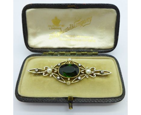 A yellow metal, pearl, diamond and green stone brooch, one pearl missing, 57mm