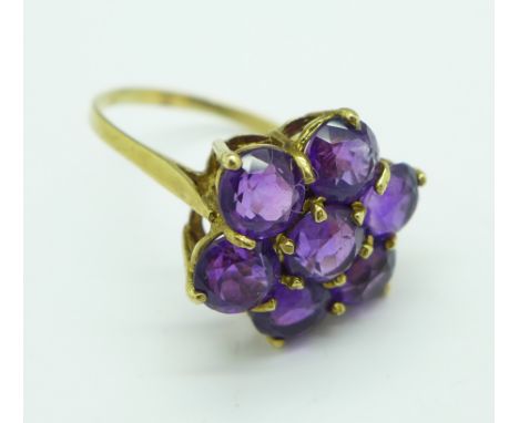 A 9ct gold and amethyst cluster ring, 3.7g, R