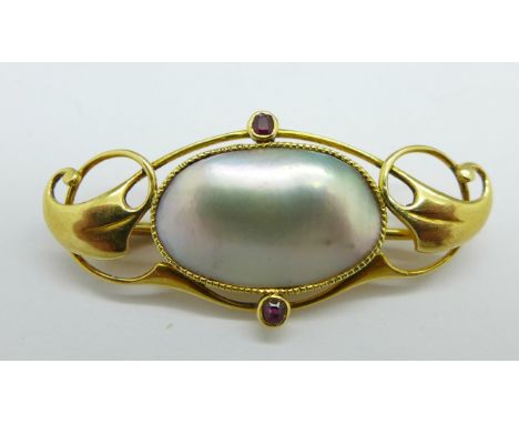 A 15ct gold Murrle Bennett garnet and blister pearl brooch, 37mm