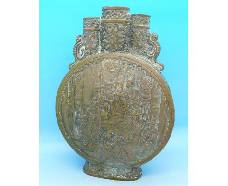 A brass oriental flask decorated with figures