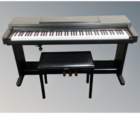 A Yamaha Clavinova CLP-560 electric piano with advanced wave memory together with stool and instruction manual 