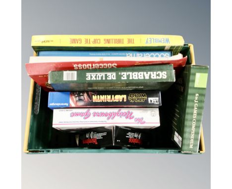 A box containing vintage board games including Wembley The Thrilling Cup Tie Game, Soccerama, Soccer Boss etc.