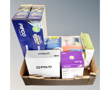 A box containing two Pifco cordless power scrubbers, a Light N Easy garment steamer, a Wagner Studio paint spraying system to