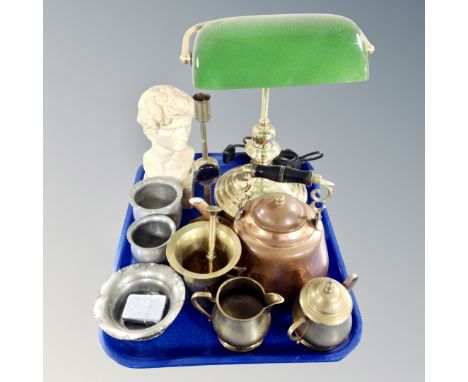 A tray containing a contemporary banker's lamp, vintage metalware including a brass pestle and mortar, a copper and brass ket