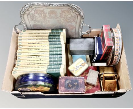 A box containing an antique plated twin handled tray, Japanese lacquered boxes, vintage tins, a set of medical and health enc