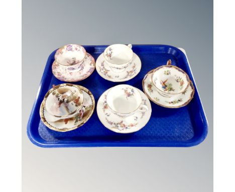 A tray containing a pair of antique Minton Spring Flowers bone china teacups and saucers together with three further teacups 