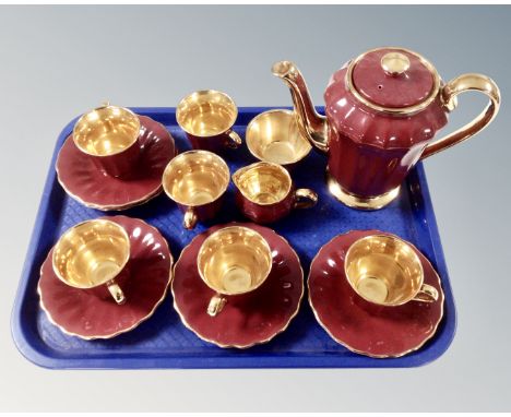 A 15 piece Wade maroon and gilt tea service.