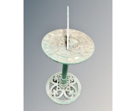 A cast iron sundial on pedestal.