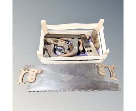 A tray containing a quantity of vintage woodworking tools together with two further handsaws.