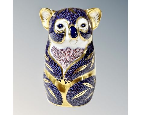 A Royal Crown Derby Imari koala paperweight with silver stopper.