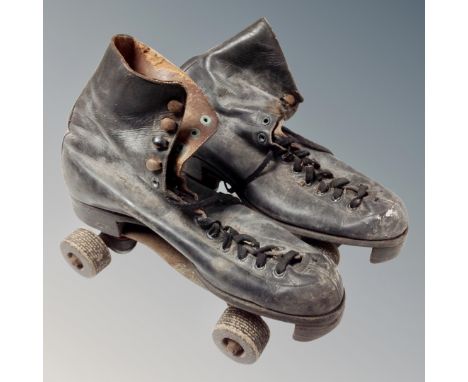 A pair of vintage roller blades.