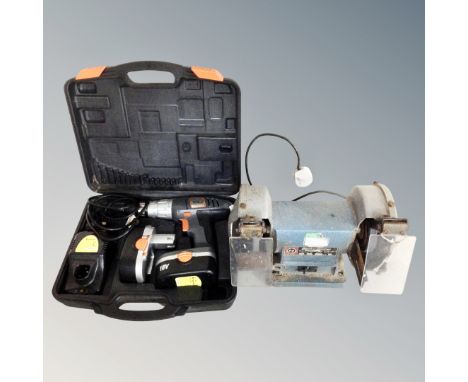 A Black and Decker bench top electric grinder together with a Challenge Xtreme 18v electric drill with batteries and charger 