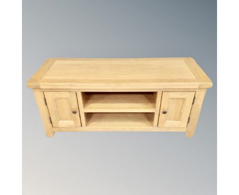 Oakland Furniture : A contemporary oak television stand fitted cupboards and shelf beneath, width 120cm 