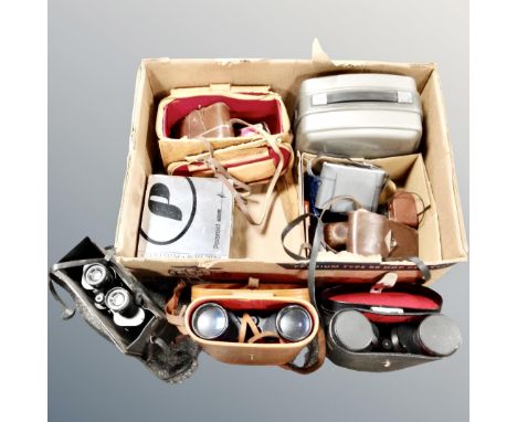 A box containing field glasses by Skybolt, Ranger and Prinzlux, all cased, vintage cameras etc.
