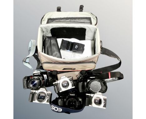 A camera bag containing assorted Minolta, Pentax and Canon cameras including Canon EOS 1000F, together with lenses.