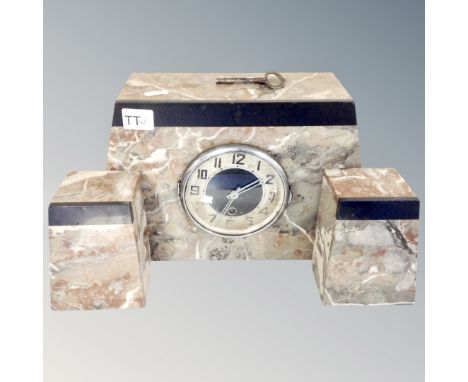 A three piece Art Deco marble clock set.