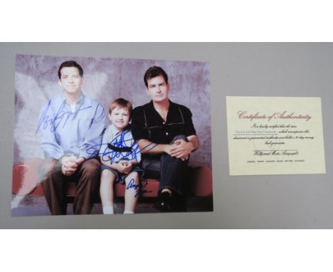 Two &amp; A Half Men sofa promotional signed photo signed in blue pen including autograph of Charlie Sheen. (1)