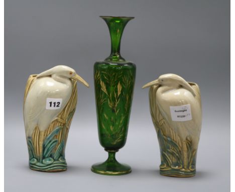 A Bohemian green and gilt glass vase, and a pair of ceramic wall pockets in the form of herons tallest 31cm