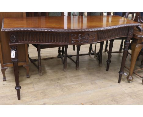 A serpentine serving table W.153cm