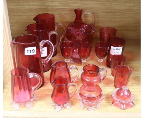 A collection of eighteen pieces of Victorian cranberry, glassware, together with a painted three shelf wall bracket tallest 1