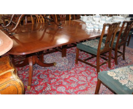 A Regency style mahogany two pillar extending dining table, the top 10ft x 4ft 6in, fully extended 300cm. fully extended