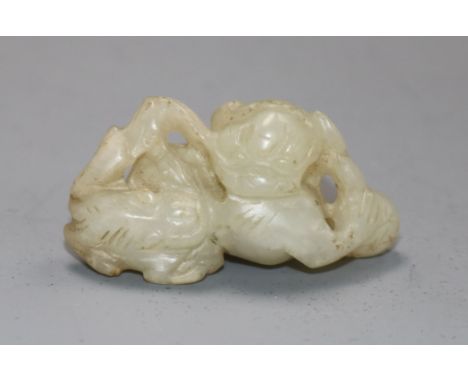 A 19th century Chinese pale celadon jade lion-dog and cub carving