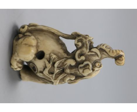 An early 20th century Japanese ivory netsuke of a Baku