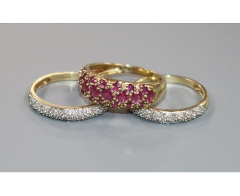 A modern 9ct gold, ruby and diamond triple ring set, size N.