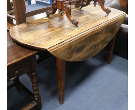 A late George III mahogany oval topped drop leaf dining table W.149cm