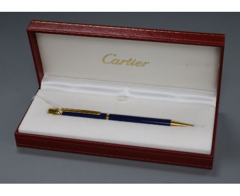 A Must de Cartier 'Trinity' blue and gold-coloured ballpoint pen, boxed