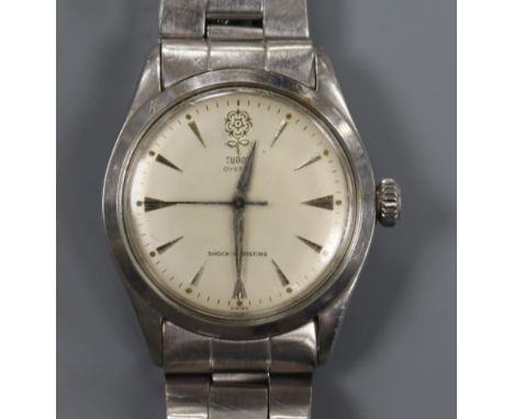 A gentleman's stainless steel Tudor Oyster manual wind wrist watch, on a stainless steel Rolex bracelet.
