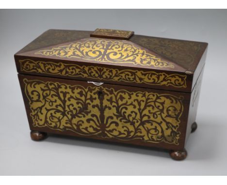 A Regency rosewood two-division tea caddy, of sarcophagus form inlaid with cut brasswork (two canisters, bowl deficient) leng