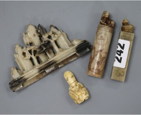 Two Chinese soapstone seals, a similar brush rest and an ivory netsuke