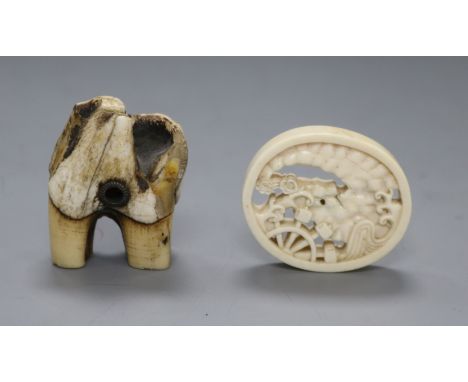 A 19th century Japanese ivory oval manju netsuke and a stag antler root netsuke,