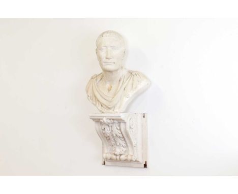 A plaster portrait bust, of recent manufacture, depicting Julius Caesar, on an acanthus-decorated bracket,39cm wide25cm deep7