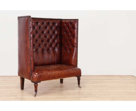 A buttoned-leather high-back wing chair, probably late 20th century but incorporating 19th century elements, with studded det