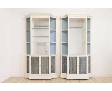 A pair of Regency-style breakfront bookcases,late 20th century or later, white painted, each with an upper section mounted wi