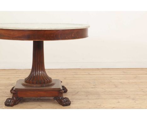 A Charles X mahogany guéridon, c.1825, French, the circular marble top with a moulded edge, above a plain frieze, and raised 