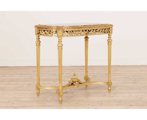 A Louis XVI-style giltwood side table,late 19th century, French, the shaped top inset with rouge marble, with a ribbon and st