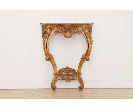 A carved giltwood pier table,late 19th century, Italian, with a serpentine top above a floral and foliate-decorated frieze, r