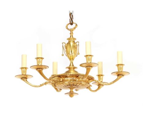 A Regency-style gilt-brass electrolier, first half of the 20th century, with an urn-shaped column and ram head detail, the bo