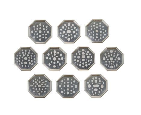 A set of ten plaster intaglio displays,of recent manufacture, each of octagonal form, containing approximately thirty various