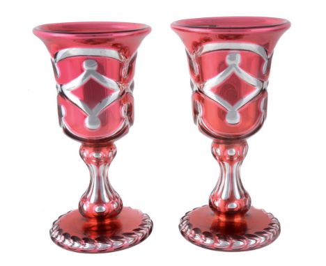 A PAIR OF VARNISH & CO. PALE-RUBY FLASHED, SILVERED AND CLEAR GLASS OVERLAY GOBLETSMID 19TH CENTURYThe bell bowls cut with a 